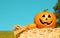 Halloween Pumpkin, funny Jack O\'Lantern on Straw Bale over Sky.