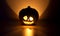 Halloween pumpkin glow on a dark background