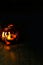 Halloween pumpkin head bowl lantern on dark background