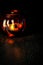 Halloween pumpkin head bowl lantern on dark background