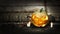 Halloween pumpkin head jack lantern with burning candles on dark moody background