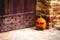 Halloween pumpkin head jack lantern outside door of castle