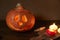 Halloween pumpkin head lantern on wooden background . Jack-o-lantern carved pumpkins for Halloween close up. Halloween pumpkin