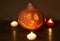Halloween pumpkin head lantern on wooden background . Jack-o-lantern carved pumpkins for Halloween close up. Halloween pumpkin