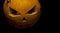 Halloween, pumpkin head with a sinister grin. Lights instead of eyes. Holiday of the dead Halloween