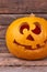 Halloween Pumpkin lantern with carved smiling face.