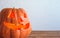 Halloween pumpkin lantern close-up on a gray background. Copy space