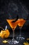 Halloween pumpkin orange cocktails. Festive drink. Halloween party. Funny Pumpkin with holiday  decorations