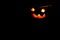 Halloween pumpkin smile and scary eyes for a party, Jack Lantern isolated on black background