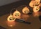 Halloween pumpkin string lights glowing  on acoustic guitar. Halloween party concept