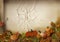 Halloween pumpkins and autumn leaves on cracks background