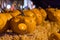 Halloween pumpkins at night on hay bale.