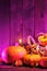 Halloween pumpkins in pink light