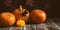 Halloween. Pumpkins and spider on an old wooden table. Autumn composition. Selective focus, banner