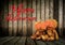 Halloween Pumpkins on wood background with message \'Happy Halloween\'