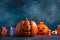 The Halloween`s smiling angry pumpkins isolated on dark blue background. Halloween banner. Holiday concept
