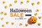 Halloween Sale message with pumpkin overhead view