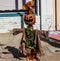 Halloween Scarecrow With Ragged Coat On Sidewalk