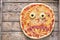 Halloween scary food funny monster face pizza horror snack with mozzarella
