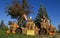 Halloween scene of a vehicle made from bales of straw, stuffed animals, tires and pumpkins