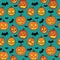 Halloween seamless pattern with orange pumpkins carved faces and black bats on turquoise background