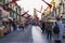 Halloween shopping stalls with stuff on streets of Malta during Halloween celebrations and walking crowd of people