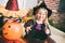 Halloween: Smiling Little Girl Witch Witch Candy Cauldron