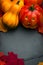 Halloween still life with jack o`lantern, pumpkins, fallen orange leaves and copyspace for your Halloween holiday text