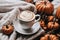 halloween still life with latte, decorations and pumpkins , holiday background
