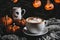 halloween still life with latte, decorations and pumpkins , holiday background