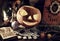 Halloween still life with witch book, Jack O Lantern pumpkin, tarot card and runes