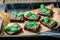 Halloween style party sweet - brownie with green skeleton and bones