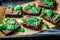 Halloween style party sweet - brownie with green skeleton and bones