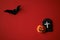 Halloween symbols origami on a red background