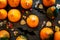 Halloween symbols. Pumpkins and cute figures of halloween evils. Bats. dark wooden background top view