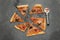 Halloween-Themed Pizza Cut Into Portions Alongside a Pizza Cutter