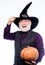 Halloween traditions. evil wizard hold orange pumpkin. bearded man ready for halloween party. Stargazer in holiday