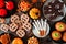 Halloween treat table scene, above view over a rustic dark wood background