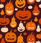 Halloween vector seamless pattern. Decorative background with funny drawing pumpkins. Cute silhouettes.