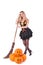 Halloween witch in dress with pumpkin, broom