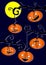 Halloweens pumpkins on tree branches. Dark sky