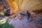 Halls Creek - May 15 2017: A hiker views indigenous art gallery in Caves in the Bungles