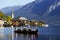 HALLSTATT, AUSTRIA, 19 OCTOBER, 2018: The hunters from Hallstatt town in a boat on the lake in a autumn foggy morning