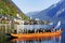 HALLSTATT, AUSTRIA, 19 OCTOBER, 2018: The hunters from Hallstatt town in a boat on the lake in a autumn foggy morning