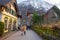 Hallstatt/Austria- December 26, 2019: Tourists on the streets of Hallstatt, a charming traditional village and a famous tourist