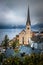 Hallstatt, Austria - Hallstatt, the famous Unesco protected lakeside town with Hallstatt Lutheran Church on a foggy day