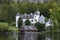 Hallstatt view of an old white castle, tree and lake at the Hallstatter See Lake in High