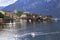 Hallstatt village and swans reflections into the lake, Austria