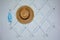 Hallway cloakroom with a protective mask and a straw hat