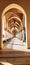 Hallway in an elegant Arabian palace, with arches and pillars, flower arrangements, symmetry, play of light